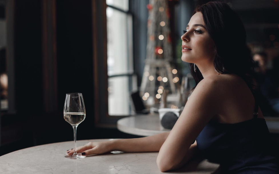 Elegant woman enjoying a glass of wine