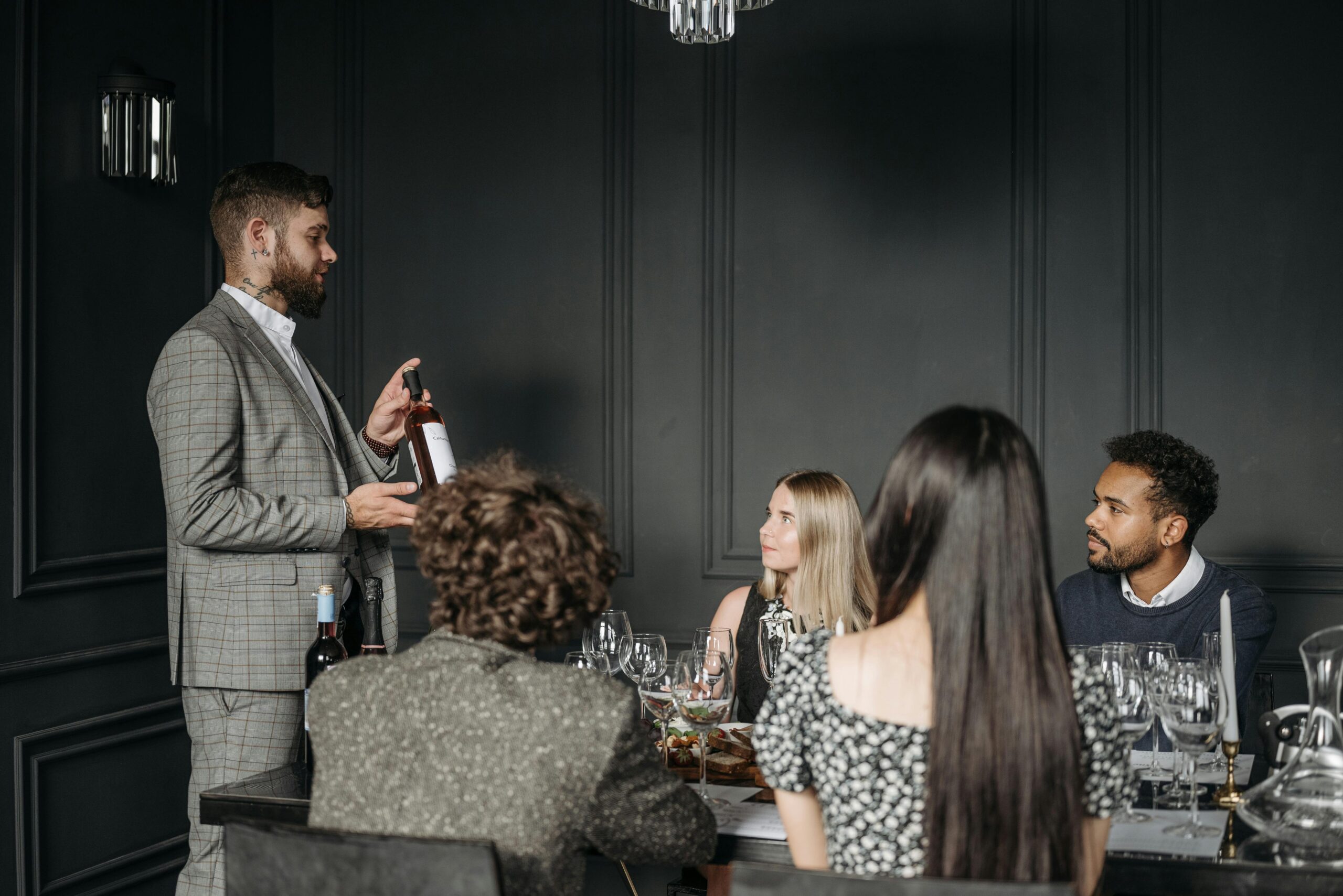 A sommelier explaining about wine tasting