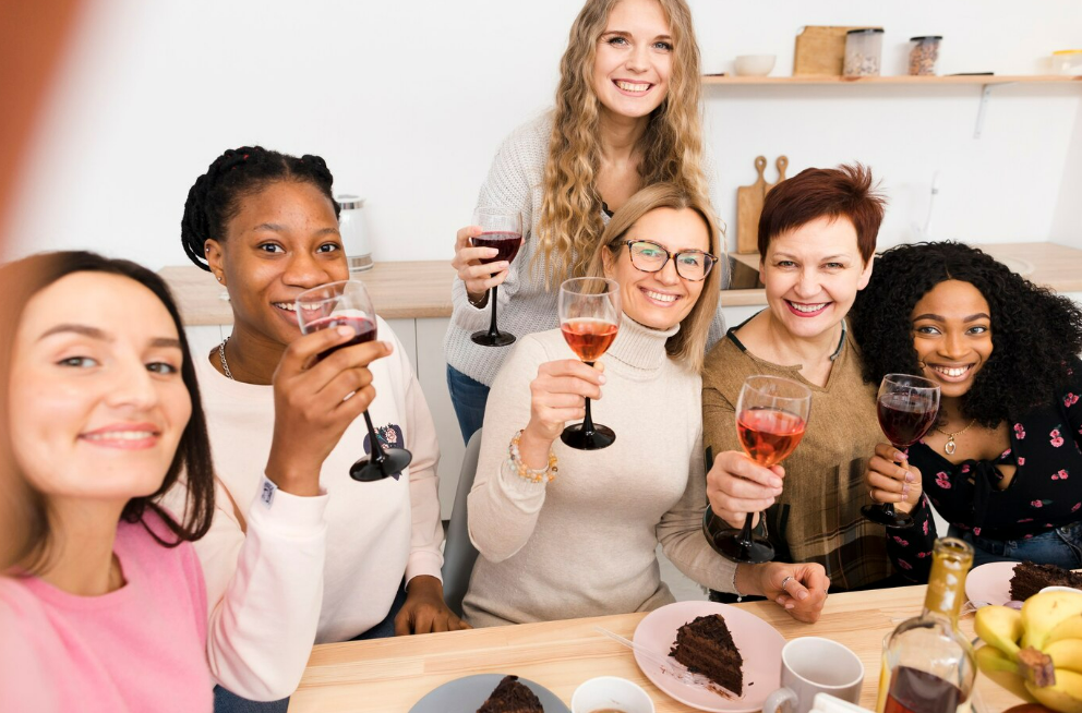 A group of friends celebrating with a wine