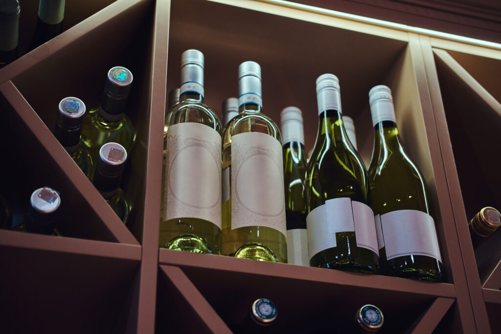 Bottles Of Wine On A Stored Shelf