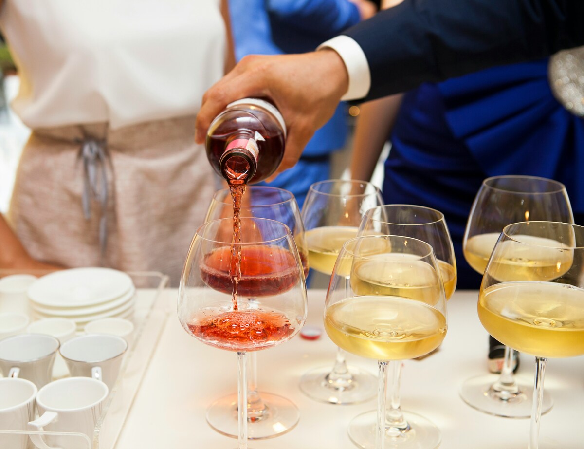 A sommelier pouring wine for wine tasting